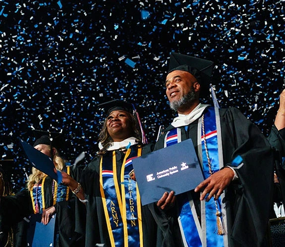 graduates in confetti at commencement